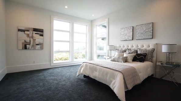 Screen Shot 2022-09-12 at 1.45.34 PM bedroom with grey painted walls in Kelowna. interior is painted and light shining in windows