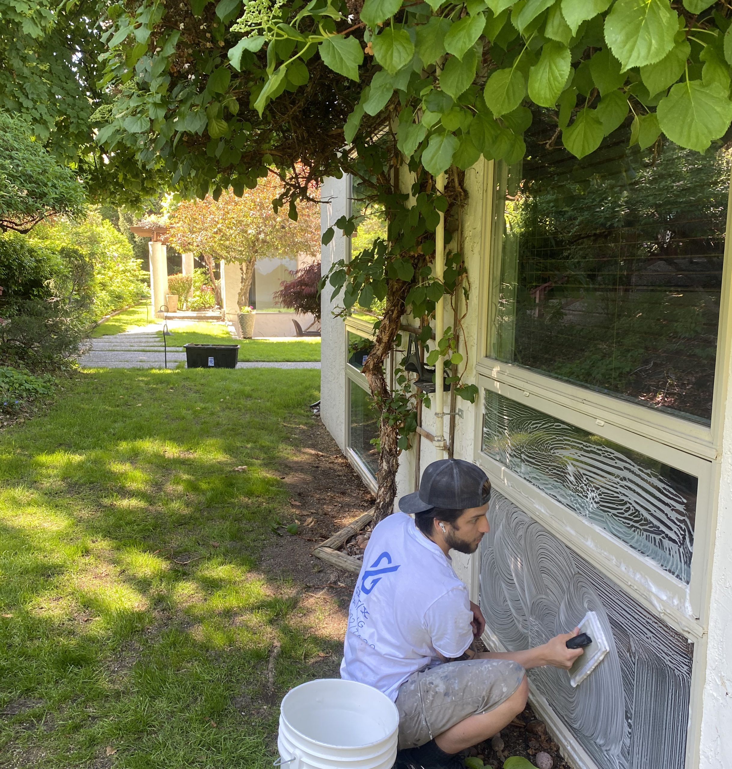 professional window cleaning service being performed on exterior of residential home in kelowna bc