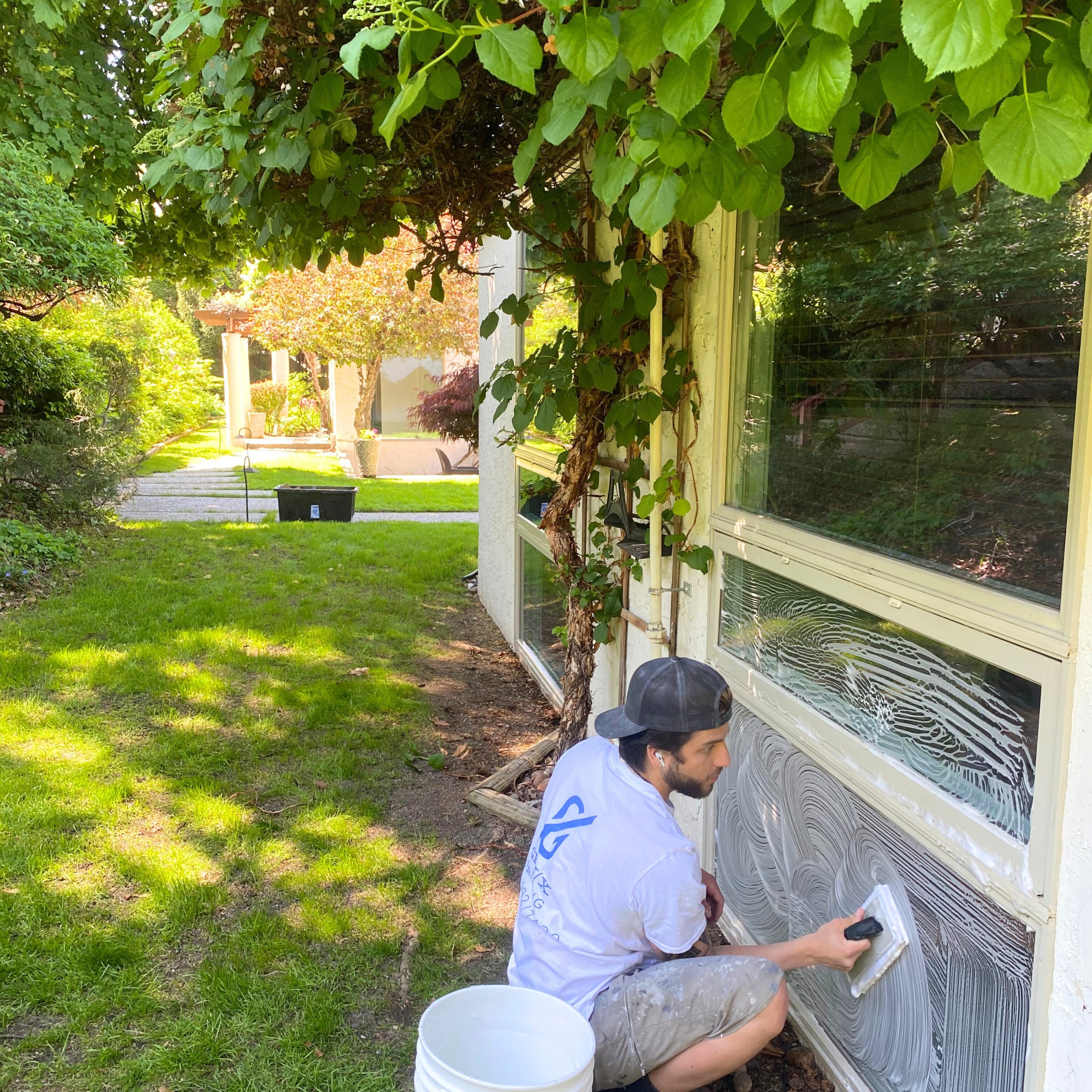 professional washer cleaning an exterior window in kelowna bc